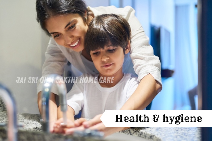 A mother guiding her child in proper handwashing for better hygiene at home at Jai Sri Ohm Sakthi Home Care in Coimbatore